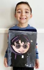 Christopher Casale holds his painting of Harry Potter which hung in the gallery at the Greenwood Lake Public Library. Provided photo.