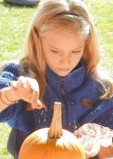 More than 1,300 children rushed to pick pumpkins, eat apples, drink apple cider, select chocolate and toys, choose library bookmarks and fill bags with the chamber’s pretzels, candy and gift items at Pumpkinfest at the Pine Island Park.