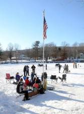A frozen Greenwood Lake continued to draw residents from the community onto the ice for ice fishing, using ATV’s, snow walking and this tailgate party. Photo by Ed Bailey.