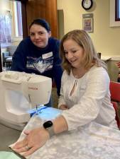 Maddy Todd and Shawn Cammarota during the March 4, 2023 “Simple Sewing Project with Repair Cafe Experts” workshop at the Albert Wisner Public Library.