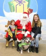 Kate Ravielli and her son Rahim, 4, posed with Santa and their Pitbull “Belly,” a graduate of the Warwick Valley Humane Society’s Animal Shelter. As a side note, the dog’s original name was “Scully,” but Rahim found it easier to say ”Belly and that’s how it will be.