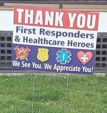 Pete and Tammy Artusa from Warwick helped raise more than $4,000 with donations from residents who purchased First Responder Health Care Hero signs. With the money raised will be used at local restaurants to feed local first responders.