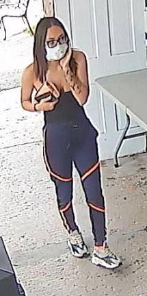 Gardiner. State police are investigating counterfeit bills being passed in the Hudson Valley State Police said this woman, who had tattoos on her right forearm, left arm and on her chest that said “Ethan” in a circle, passed a counterfeit 100-dollar bill at a farm market in Gardiner on Sept. 14. Photos provided by the New York State Police.