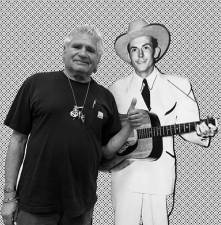 Thumbs up for Hank Williams Sr. on the guitar.