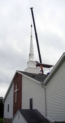 New steeple tops Calvary Baptist Church New steeple tops Calvary Baptist Church