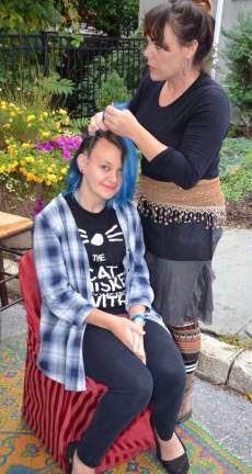 Applefest 2016 draws large crowds despite light rain and cooler weather Warwick eighth-grader Gabrielle Wilbur gets her hair braided by Jody Williams of Signature Braids, New Paltz.