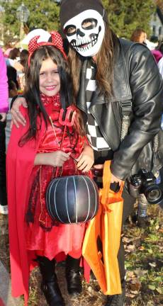 Annual Lions Club and Village of Warwick Halloween Parade draws 1,200 witches, goblins and other assorted characters Lydia Rivera, 8, with her mom Lorice Angie, switched from last year's angel costume to one as a devil.