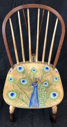 Warwick students rock the art world This is one of more than 20 painted chairs available to be auctioned, with 100 percent of the proceeds going to graduating seniors in the form of scholarships. Katarina Tomich created the peacock and its feathers that adorn the chair.