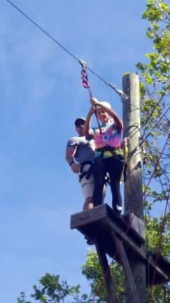 New season brings new activities Provided photo Warwick Physical Education instructor Shad Scarpulla instructs a student on the high ropes course on campus at Warwick Valley High School.