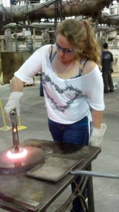 S.S. Seward artist creates winning design Cortnie Plocharzcyk presses her sun catcher at the Gillinder Glass factory in Port Jervis.
