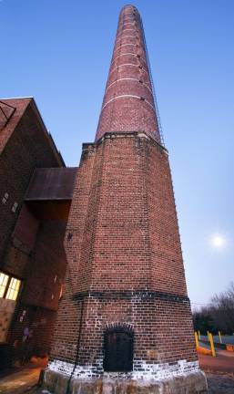 Photo by Robert G. Breese An old smoke stack on teh Mid-Hudson prison property.