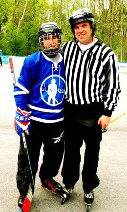 Warwick gains Home Rink Advantage Player Rob Favara shared a moment for the camera with Tony Romagnino, Monroe-Woodbury Roller Hockey League president, who refereed the game.