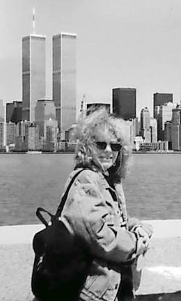 Betsy Utnick in Hoboken with the World Trade Towers in the background across the Hudson River.