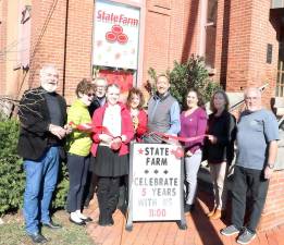 On Friday, Nov. 1, members of the Warwick Valley Chamber of Commerce joined partners Phillip Williams and Christine Held Adams (center) to celebrate the fifth anniversary of the State Farm – Williams Insurance and Financial Services office outside the firm’s Clocktower Building office.