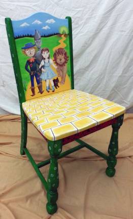 There is a chair for everyone A have along the Yellow Brick Road: Melanie Loprena illustrated her chair with the characters from L. Frank BaumþÄôs þÄúThe Wonderful Wizard of Oz.þÄù