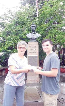 Florida Chamber of Commerce secretary Beth Fuller presents James Piscitelli with the J.M. Mabee Electric scholarship.