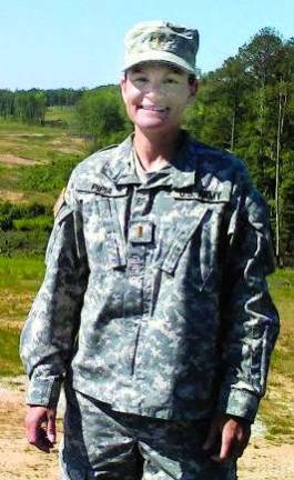 Local Army officer deployed to Afghanistan 1st Lt. Tara Pipia at a 50-Cal (M2) range.