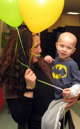 Warwick community pours out its heart for a child with brain cancer Photo by Roger Gavan Victoria Kamback holds her son Evan, 4, who was diagnosed with brain cancer.