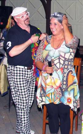 ‘The most amazing Warwickian’ Photos by Roger Gavan Tim Mullally, chair of Ladies Night Out, crowns Terry Odell Queen for a Day.