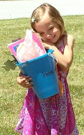 Penelope Lopez, 4, with her gifts.