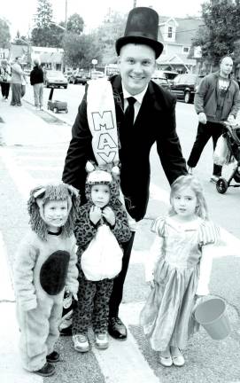 Greenwood Lake gets an early start for Halloween Mayor Jesse Dwyer and his two children: Aiden Dwyer, 2, Emma Dwyer, 3, and their friend Adalynne Forchette.