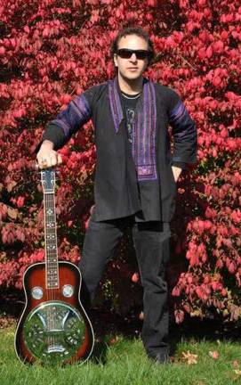 Greenwood Lake Public Library announces programs in December Singer/guitarist Chris Merwin will go through the roots of popular American music with a selection of blues, country, bluegrass and gospel, accompanied by his collection of steel guitars, at the Greenwood Lake Public Library on Saturday, Dec. 16, from 2 to 3 p.m.
