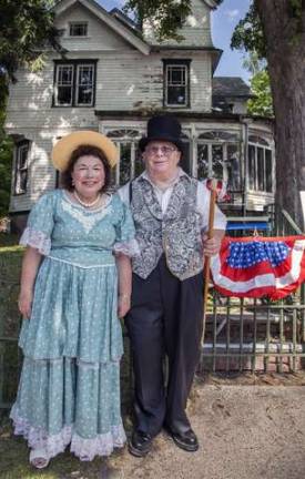 Celebrating community in Florida, NY Ed and Linda Dubin of Florida NY dressed in nineteenth century clothing and standing in front of the Victorian Mapes House on Main Street during the Florida Funfest on Sunday August 10, 2014. Ed and Linda are members of the Seward/Mapes House Restoration Committee.