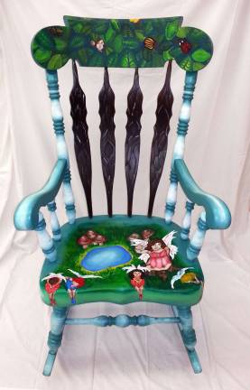 Bidding underway for Scholarship Chair Auction Samantha Hansen's chair of fairies will be among the 22 chairs crafted by students and the High school Art department teachers available at next Friday's art show and auction.