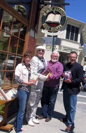 Annual Sidewalk Sale to help support Literacy Orange To help support Literacy Orange's book sale; the merchants are asking people to donate used books and deliver them to Ye Olde Warwick Book Shoppe at 31 Main St. in the Village of Warwick. From left, Literacy Orange Executive Director Christine Rolando, Sidewalk Sale co-chair Tim Mullally, Ye Olde Warwick Book Shoppe owner Thomas Roberts and author and Literacy Orange volunteer Tom Mattingly, holding a copy of his book, "The Single Father's Guide."