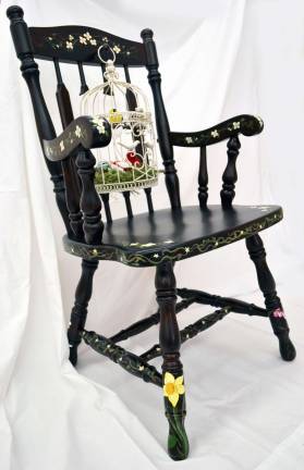 Art that will rock you Bridget DeHaan created this bird cage chair for the district wide auction on May 3 to raise scholarship funds for graduating high school seniors.