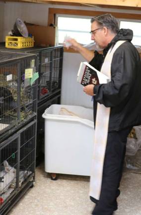 Warwick Valley Humane Society holds blessing of animals at its animal shelter Blessing the rabbits.
