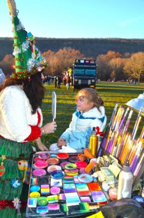 Aurora Wright, 5, of Greenwood Lake, daughter of Adrienne and Matt, gets hers face painted.