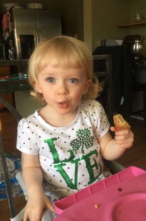 One Lucky Leprechaun Hailey (2.5 years old) is enjoying her Irish soda bread on St. Patrick’s Day!