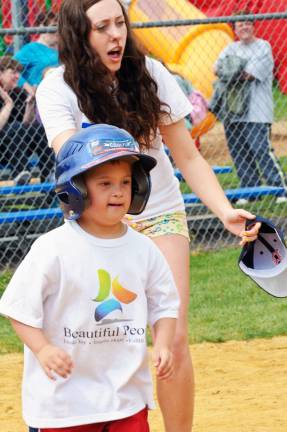 Beautiful People begin another special season of baseball Credit: Jamie Kaminski Photography Patrick Mataraza (8) with volunteer buddy Ali Smith (17) during last last Sunday's was opening day for Beautiful People adaptive baseball. Photo credit: