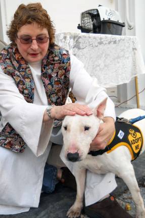 Pet blessing goes to the dogs This good-looking pup appears soothed by the hands-on blessing from Pastor Lynne Severance.