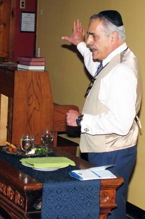 ‘Why is this night different than any other night?’ The questions were answered by Moshe Schwartzberg, who, with the aid of a slide projector depicting Biblical events, explained the story of how the Israelites became slaves in Egypt and how Moses, after threatening Pharaoh with 10 plagues, led them in an Exodus.