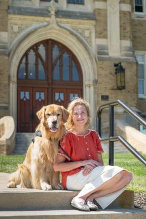 Golden retriever aids professor, college students Mount Saint Mary College’s Nancy Gartin-Checchi with her golden retriever Mac. Photo by Lee Ferris