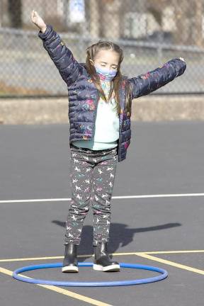 First graders at Park Avenue Elementary School work on mindfulness during gym class on Nov. 16, 2020.