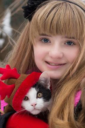 Pampered pets Submitted by Cristina Kiesel of Monroe, N.Y. "Clover's first Christmas. Clover is keeping warm in his reindeer costume."