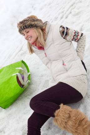 Concussions, breaks on the rise Stock image Woman slipped and injured back on icy street.