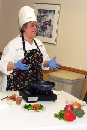 No complaints about this hospital food Carmela Decker, a chef at St. Anthony Community Hospital and a graduate of the Culinary Institute of America, prepares a chicken dish during a community presentation at April 11 at Mount Alverno Center. Decker fielded questions while demonstrating simple, tasty and nutritious ways to enhance meals.