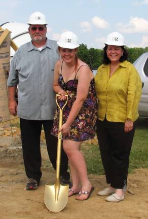 The sky is the limit Photo by Roger Gavan Caroline Moore with her parents, Bob and Nancy Moore.