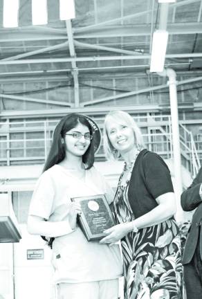 Local vocational students honored Neda Naz of Warwick was the recipient of the Outstanding Health Careers Academy Award. She is pictured with OU BOCES Cooperative Board member Virginia Esposito.
