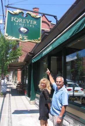 Sign of the times Photo by Roger Gavan Store Manager Kathy Demercado and co-owner Moshe Schwartzberg admire Forever Jewelersí new sign.