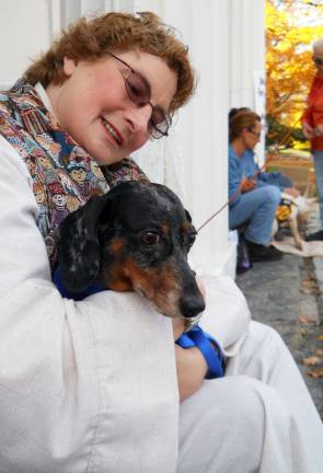 Pet blessing goes to the dogs Sugar Loaf United Methodist Pastor Lynne Severance holds one of the more than 30 dogs that were brought to the church on Oct. 20 for the annual blessing of the animals.