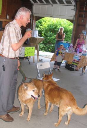 Even after nine years, someone’s still letting the dogs out John Walker, told the story of how he and his wife, Gina, had rescued and adopted Shelter dogs "Sugar" and "Spice."