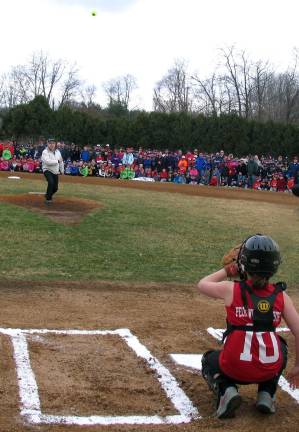 Warwick Little League celebrates opening day for 2014 baseball season Mayor Michael Newhard tossed in the first softball of the season to catcher Brigid Danaher.