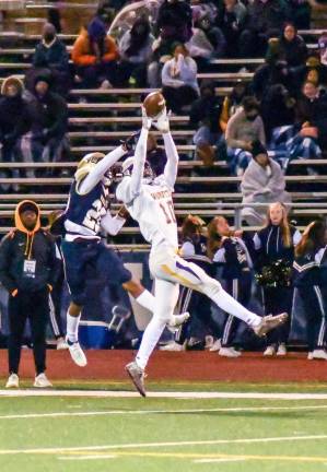 Warwick junior receiver (#10) Ryan McLaughlin goes up for a catch in the Section IX AA semifinal at NFA.