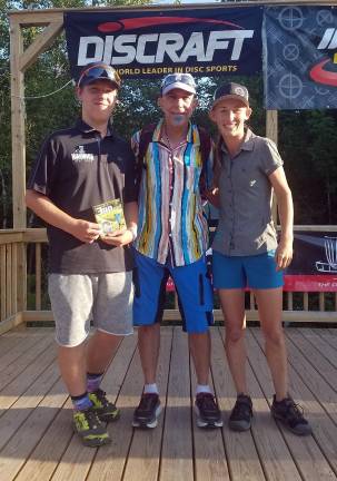 Zack Doyle, his father Dan, and four-time world women's champion Paige Pierce from Texas.