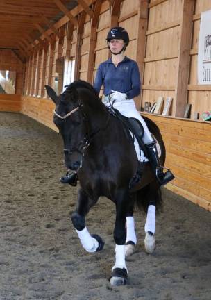 Olympian Dressage rider conducts symposium at Raven Hill Farms Among the riders during the symposium conducted by Olympian and number one ranked Dressage rider Laura Graves was Molly Maloney, a USDF bronze, silver and gold medalist atop Jhett, owned by Raven Hill Farms owner Deirdre Hamling.